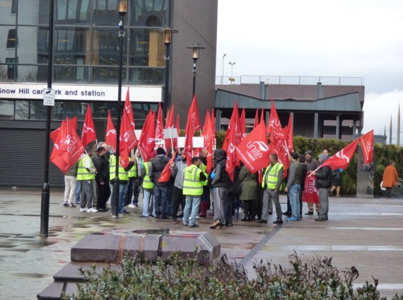 Unite members with Unite flags protest outside One Colmore Row