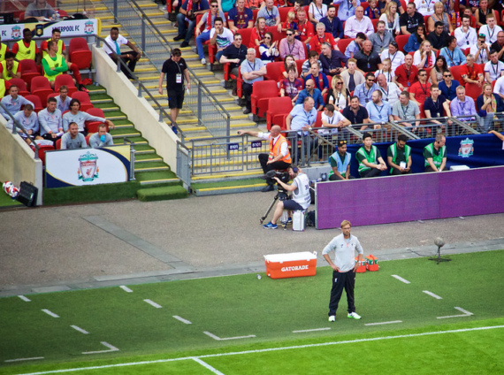 Jurgen Klopp stands on the touchline at a football match