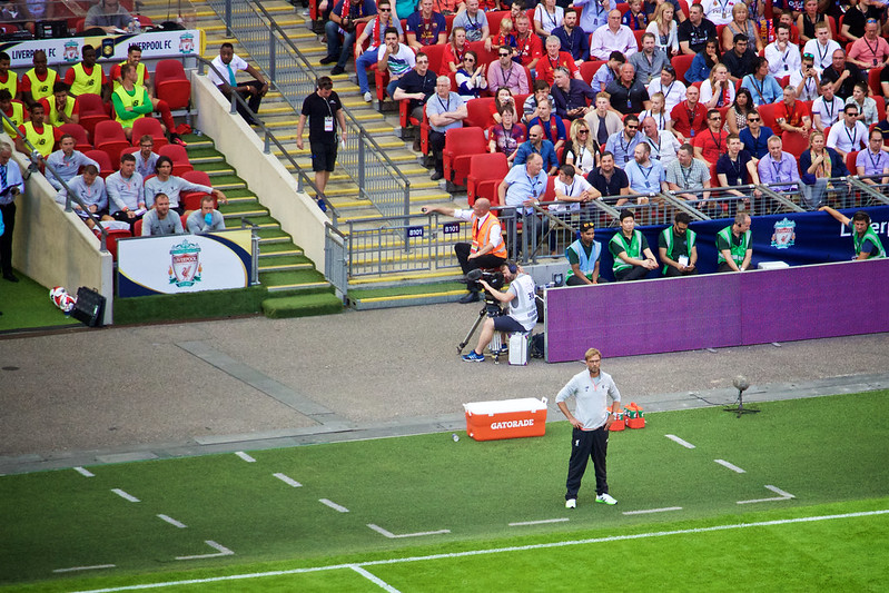 Jurgen Klopp stands on the touchline at a football match