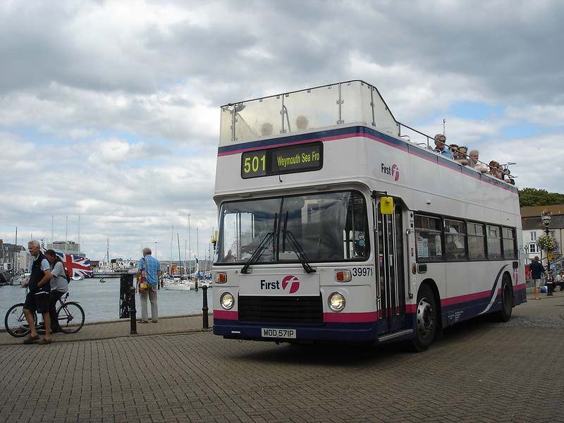 An open-top bus in Weymouth Harbour