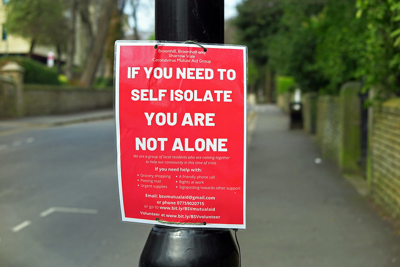 A poster for a mutual aid group that reads "If you need to self isolate, you are not alone"