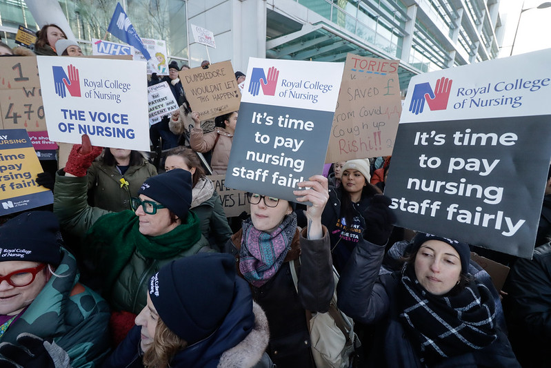 RCN members holding placards that read "It's time to pay nursing staff fairly"